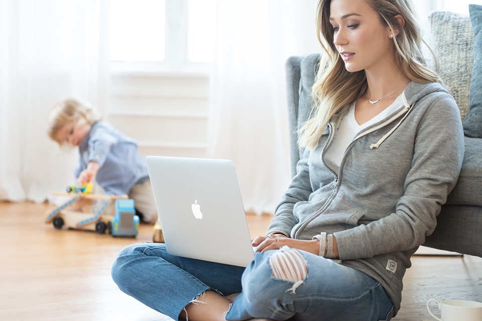 Woman working from her living room